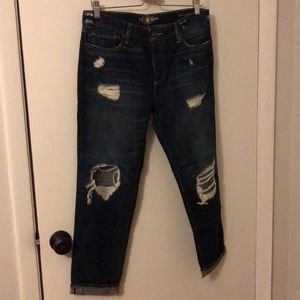 Distressed boyfriend fit jeans.
